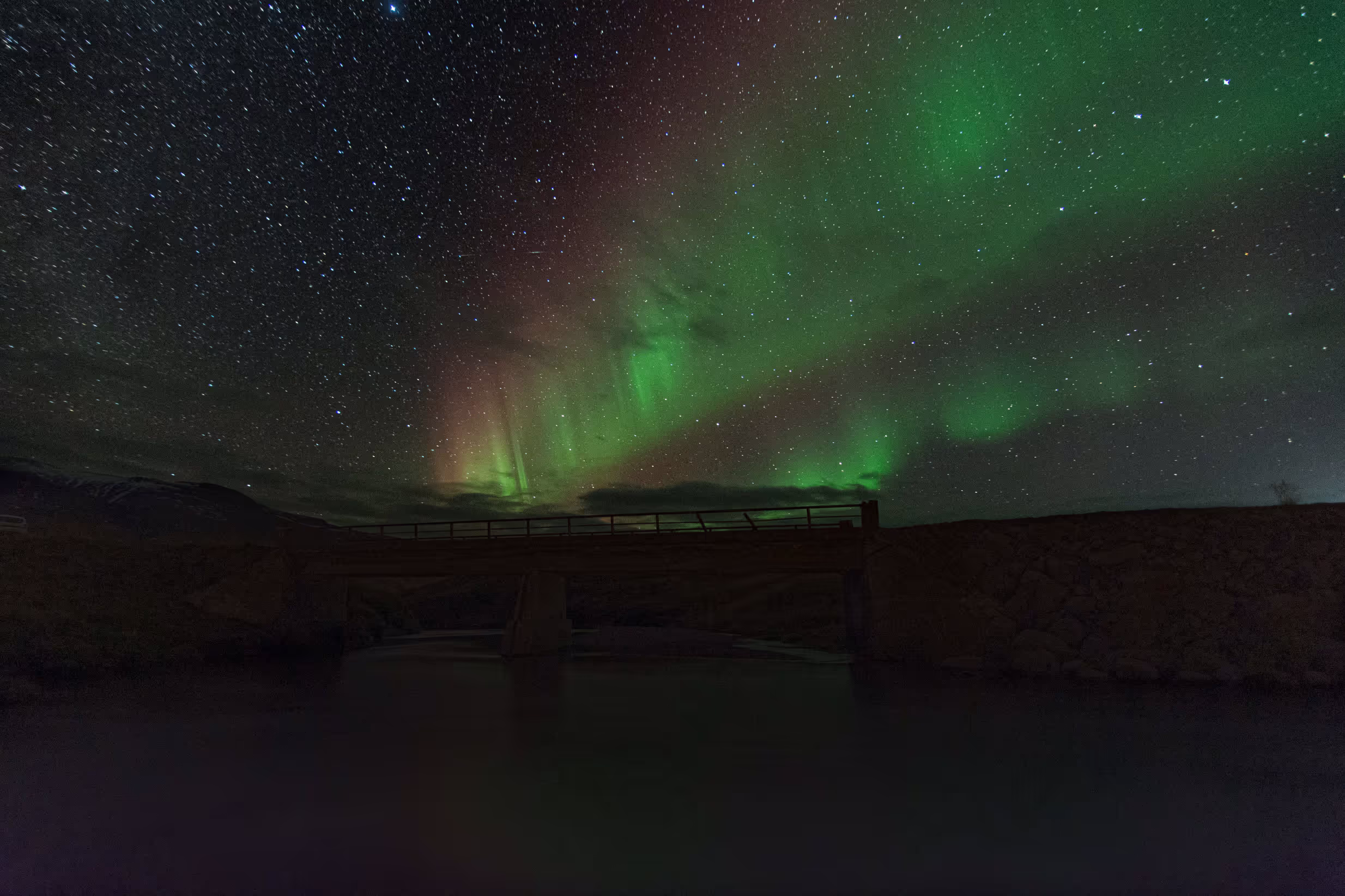 The northern lights above a bridge, taken by Miguel Tacón Oubel